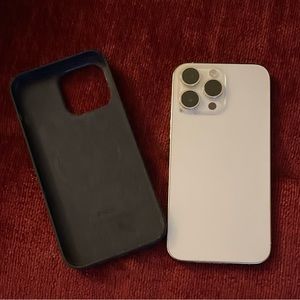 iPhone 14 Pro Max white with Mag Safe leather case.